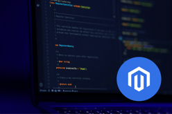 Magento logo in a blue circle overlaying code on a laptop screen