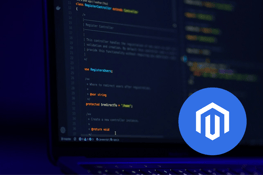 Magento logo in a blue circle overlaying code on a laptop screen