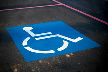 Blue disabled sign on a parking spot
