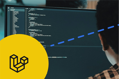 A developer works at a computer screen with code on it and there is a yellow circle on the bottom left of the image with a Laravel logo in it.