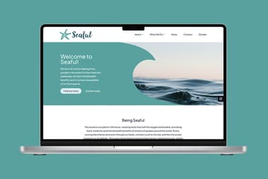 A laptop displaying the Seaful charity website on a turquoise background. The homepage features a welcoming message, information about the charity's mission to connect people with oceans and waterways, and highlights the mental health benefits of nature. The design includes a wave graphic and sections for navigation, including About, What We Do, News, Contact, and Donate.