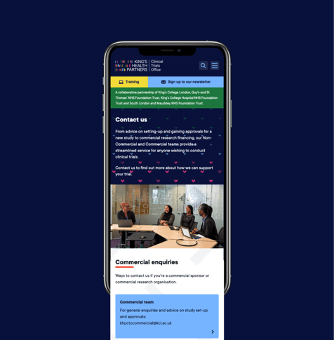 Mobile view of the King's Health Partners Clinical Trials Office 'Contact us' page, showing a dark blue hero section with contact text, a photo of four colleagues collaborating at laptops in a meeting room, and a 'Commercial enquiries' section below.