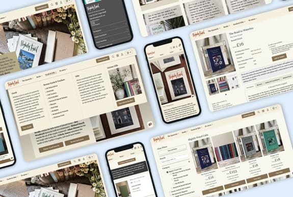 The image displays a collection of digital device screens showcasing the website for "Slightly Foxed," a literary magazine and book retailer. The layout features various sections including subscriptions, gifts, and a catalogue of books. One screen prominently displays a book titled "The Road to Waterloo" by Ronald Welch, priced at £16. Another screen highlights a collection of books with colourful covers. The background includes a textured surface with books, flowers, and stationery items, suggesting a cosy reading environment.