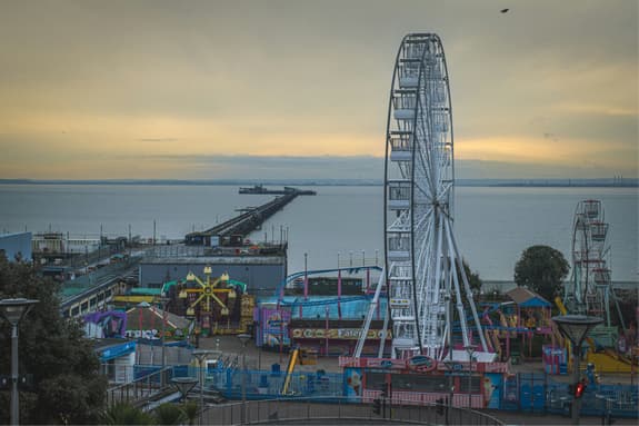 A high up photo of Southend attractions taking at twilight looking out to sea