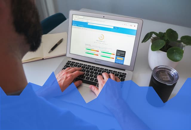 SEO work on a laptop with a blue graph overlay