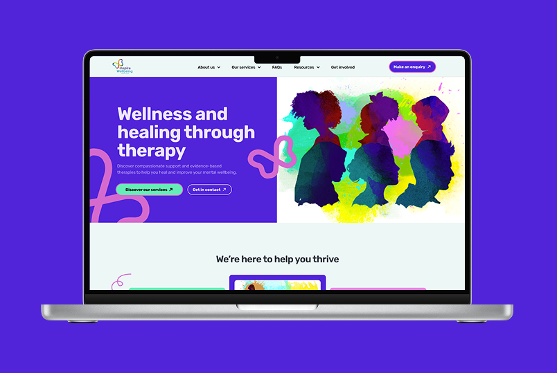 Inspire wellbeing therapy services desktop homepage on a laptop with a purple background behind